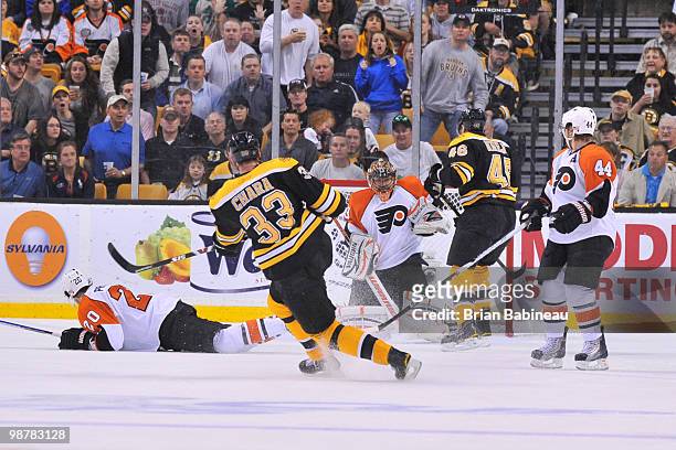 Zdeno Chara of the Boston Bruins shoots the puck against Brian Boucher of the Philadelphia Flyers in Game One of the Eastern Conference Semifinals...