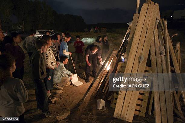 Israeli children light a bonefire in the northern city of Netanya on May 1, 2010 during celebrations for Lag Baomer, a Jewish festival which marks...