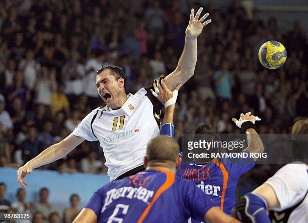 Tchekhov's Sergiy Shelmenko vies Montpellier's Issam Tej during their Champions League quart final match, on May 1, 2010 at the Rene-Bougnol stadium...