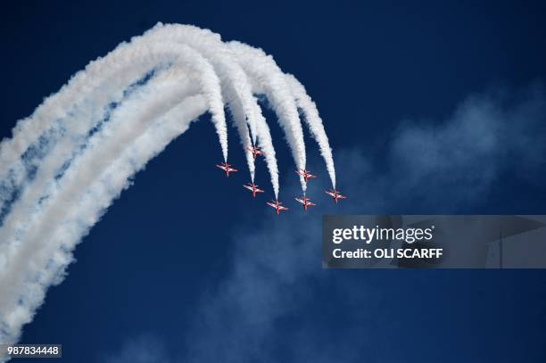 The Royal Air Force Aerobatic Team, the Red Arrows perform an aerobatic display during the national Armed Forces Day celebrations at Llandudno, north...