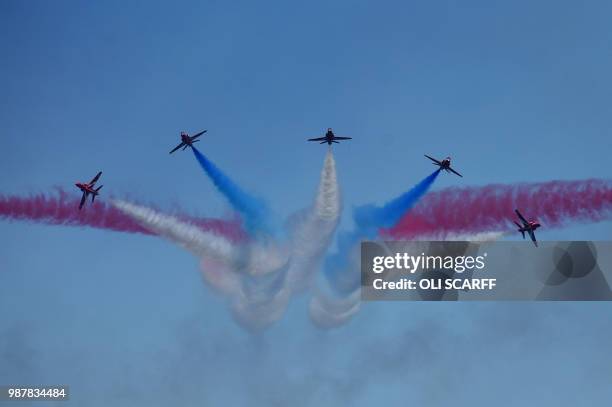 The Royal Air Force Aerobatic Team, the Red Arrows perform an aerobatic display during the national Armed Forces Day celebrations at Llandudno, north...