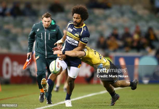 Henry Speight of the Brumbies kicks ahead during the round 17 Super Rugby match between the Brumbies and the Hurricanes at GIO Stadium on June 30,...