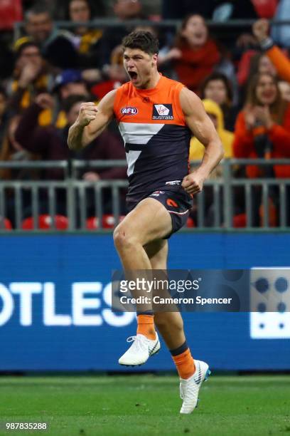Jonathon Patton of the Giants celebrates kicking a goal during the round 15 AFL match between the Greater Western Sydney Giants and the Hawthorn...