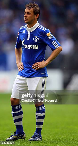 Rafinha of Schalke looks dejected after losing 0-2 the Bundesliga match between FC Schalke 04 and SV Werder Bremen at Veltins Arena on May 1, 2010 in...