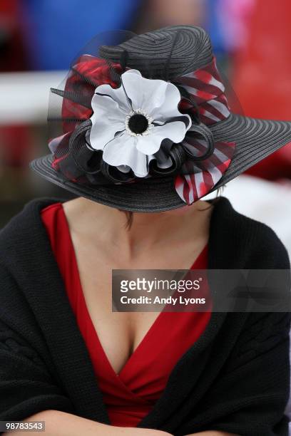 Woman is seen in the grandstands wearing a hat prior to the 136th running of the Kentucky Derby on May 1, 2010 in Louisville, Kentucky.