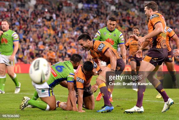 Anthony Milford of the Broncos is congratulated by Alex Glenn after scoring a try during the round 16 NRL match between the Brisbane Broncos and the...