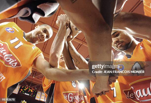 French Le Mans�s center Guillaume Yango and teammates French point guard Antoine Diot, US point guard Zack Wright celebrate at the end of the French...