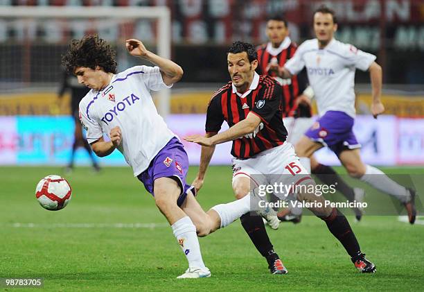 Gianluca Zambrotta of AC Milan battles for the ball with Stevan Jovetic of ACF Fiorentina during the Serie A match between AC Milan and ACF...