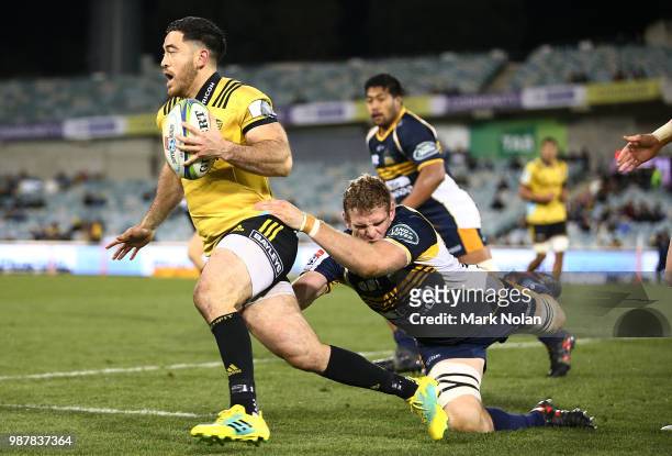 Nehe Milner-Skudder of the Hurricanes runs the ball during the round 17 Super Rugby match between the Brumbies and the Hurricanes at GIO Stadium on...