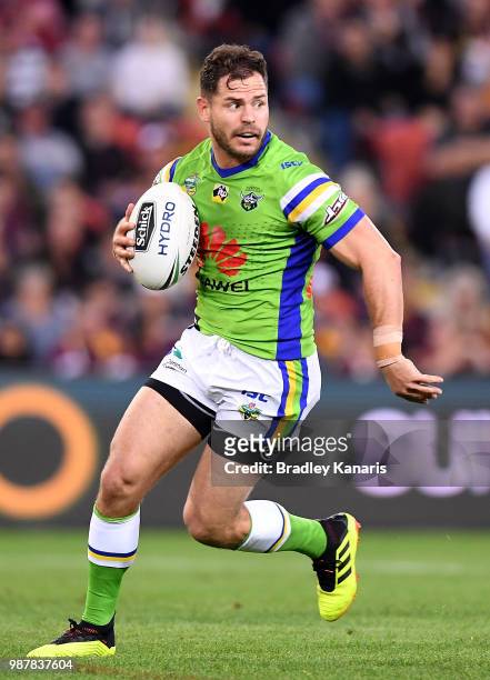 Aiden Sezer of the Raiders looks for his support players during the round 16 NRL match between the Brisbane Broncos and the Canberra Raiders at...