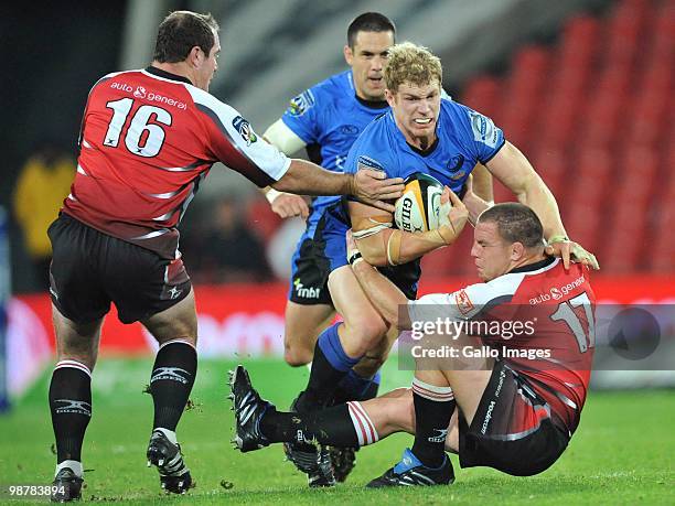 David Pocock of the Force is tackled by Hannes Franklin and Heinke van der Merwe of the Lions during the Super 14 Round 12 match between Auto and...