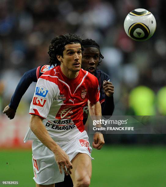 Monaco's French defender Francois Modesto vies with Paris Saint-Germain's Beninese midfielder Stephane Sessegnon during the French Cup final between...