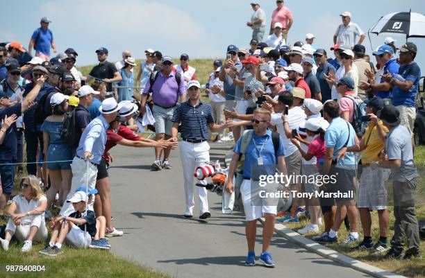 Justin Thomas of the United States arrives on the 1st tee during Day Three of the HNA Open de France at Le Golf National on June 30, 2018 in Paris,...