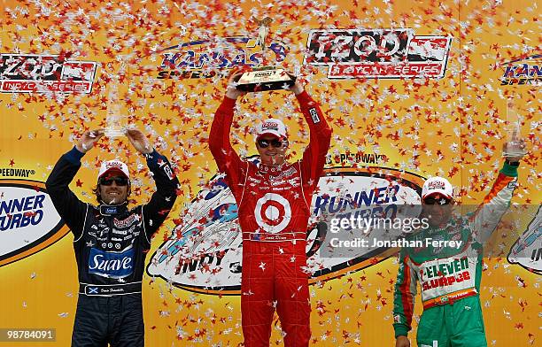 Scott Dixon driver of the Target Ganassi Racing Honda Dallara celebrates winning the Indy Car Series Road Runner Turbo Indy 300 with Dario Franchitti...