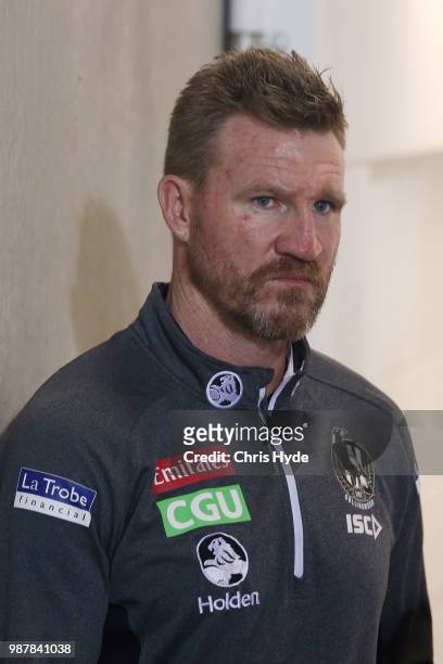 Magpies coach Nathan Buckley looks on during the round 15 AFL match between the Gold Coast Suns and the Collingwood Magpies at Metricon Stadium on...