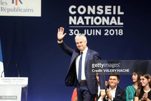 President of Les Republicains right-wing party Laurent Wauquiez waves during the national council of Republicains in "Palais de l'Europe" in Menton,...