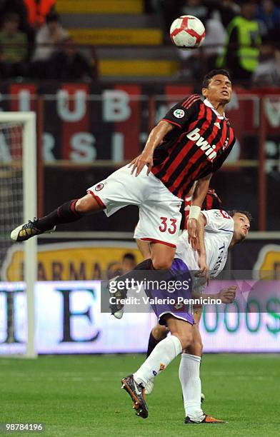 Thiago Silva of AC Milan clashes with Alberto Gilardino of ACF Fiorentina during the Serie A match between AC Milan and ACF Fiorentina at Stadio...