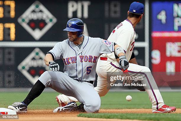 David Wright of the New York Mets slides into second base ahead of the throw to Juan Castro of the Philadelphia Phillies for a third inning double at...