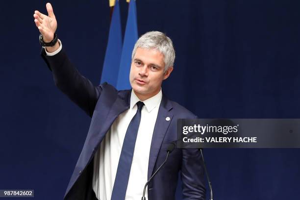 President of Les Republicains right-wing party Laurent Wauquiez waves during the national council of Republicains in "Palais de l'Europe" in Menton,...