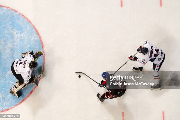 Kyle Baun of Canada takes a shot at goal during the Ice Hockey Classic between the United States of America and Canada at Qudos Bank Arena on June...