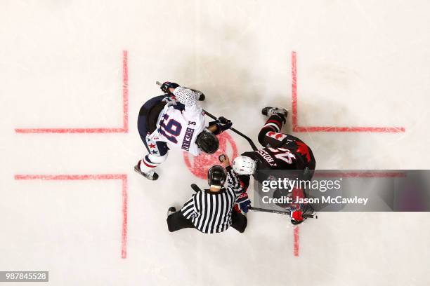 Shane Brennan of the USA and Byron Froese of Canada during the Ice Hockey Classic between the United States of America and Canada at Qudos Bank Arena...