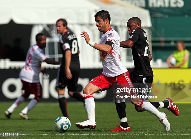 Juan Pablo Angel of New York Red Bulls passes the ball against Rodney Wallace of D.C. United at RFK Stadium on May 1, 2010 in Washington, DC.