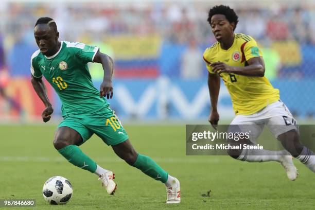 Sadio Mane of Senegal tracked by Carlos Sanchez of Colombia during the 2018 FIFA World Cup Russia group H match between Senegal and Colombia at...