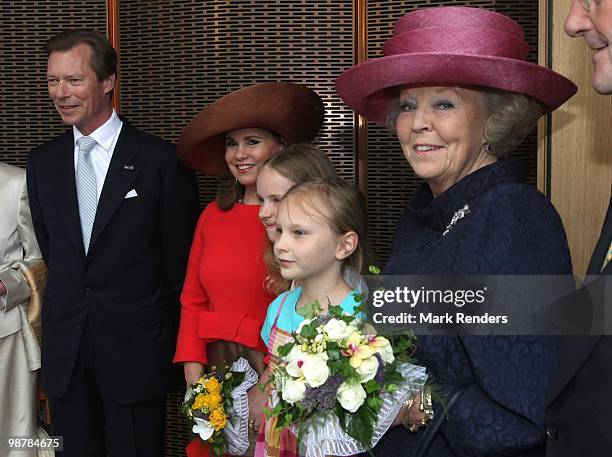 Grand Duke Henri of Luxembourg, Grand Duchess Maria Teresa of Luxembourg and Queen Beatrix of the Netherlands pose with two young girls attend the...