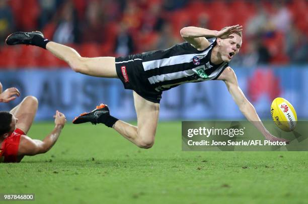 Jaidyn Stephenson of the Magpies in action during the round 15 AFL match between the Gold Coast Suns and the Collingwood Magpies at Metricon Stadium...