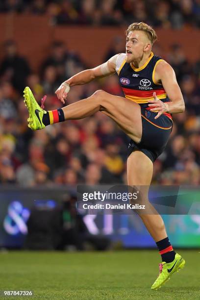 Hugh Greenwood of the Crows kicks the ball during the round 15 AFL match between the Adelaide Crows and the West Coast Eagles at Adelaide Oval on...