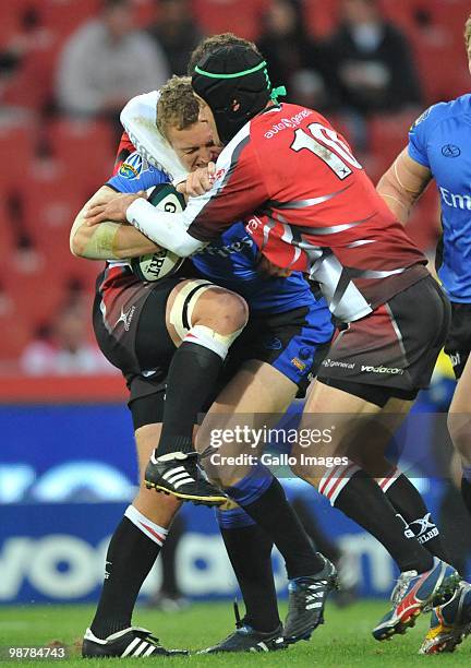 David Pocock of the Force is stopped by Herkie Kruger of the Lions during the Super 14 Round 12 match between Auto and General Lions and Western...