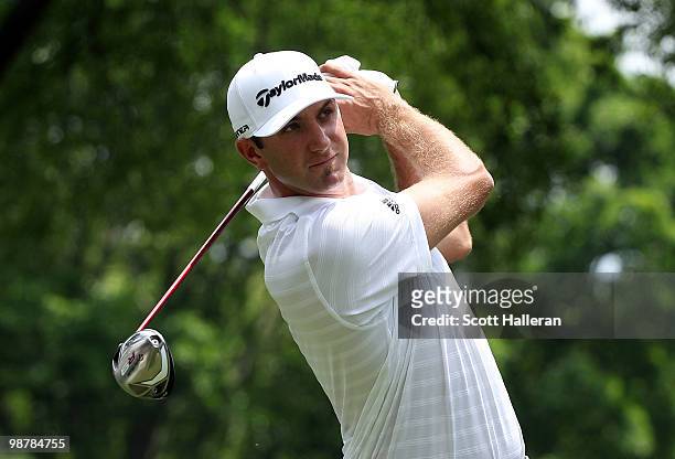 Dustin Johnson watches his tee shot on the fourth hole during the third round of the 2010 Quail Hollow Championship at the Quail Hollow Club on May...