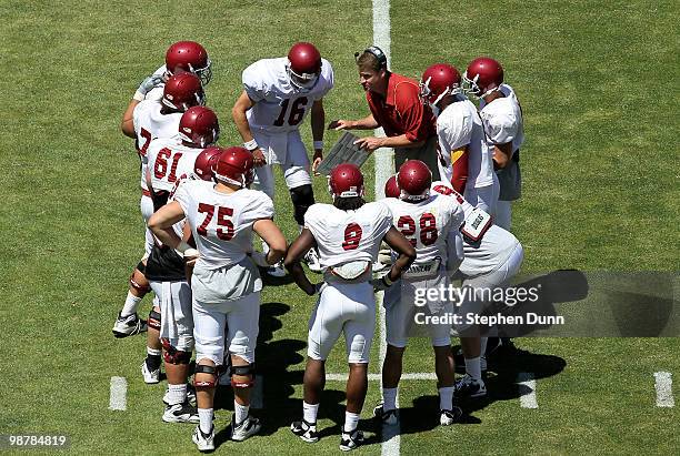 Head coach Lane Kiffin gives instructions in the offensive huddle during the USC Trojans spring game on May 1, 2010 at the Los Angeles Memorial...