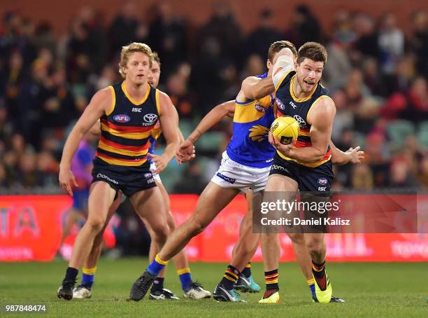 Bryce Gibbs of the Crows competes for the ball during the round 15 AFL match between the Adelaide Crows and the West Coast Eagles at Adelaide Oval on...