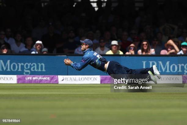 Sean Dickson of Kent takes a stunning diving catch to dismiss Lewis McManus of Hampshire during the Royal London One-Day Cup Final match between Kent...