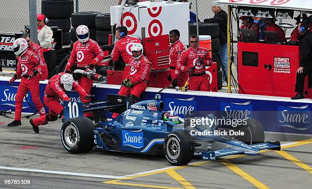 Dario Franchitti of Scotland pits his Target Chip Ganassi Racing Dallara Honda during the Indy Car Series Road Runner Turbo Indy 300 at Kansas...