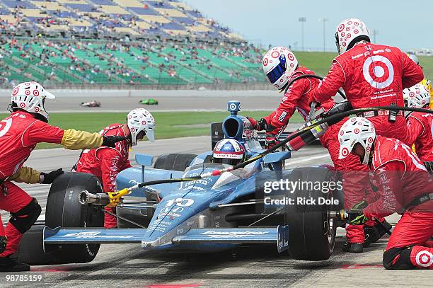 Dario Franchitti of Scotland pits his Target Chip Ganassi Racing Dallara Honda during the Indy Car Series Road Runner Turbo Indy 300 at Kansas...