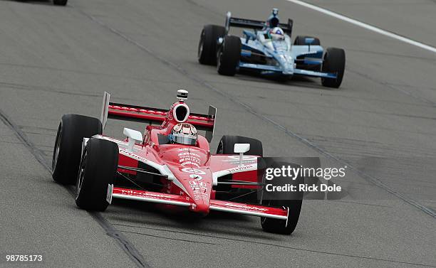 Scott Dixon of New Zealand drives the Target Chip Ganassi Racing Dallara Honda in front of teammate Dario Franchitti during the Indy Car Series Road...