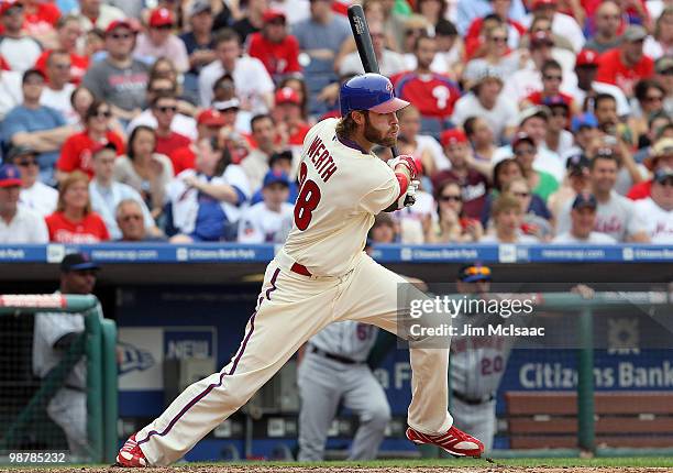 Jayson Werth of the Philadelphia Phillies follows through on a seventh inning RBI single against the New York Mets at Citizens Bank Park on May 1,...