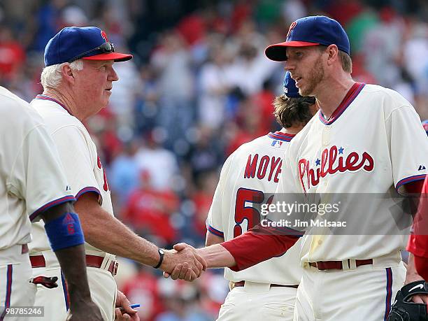 Roy Halladay and manager Charlie Manuel of the Philadelphia Phillies celebrate after defeating the New York Mets at Citizens Bank Park on May 1, 2010...