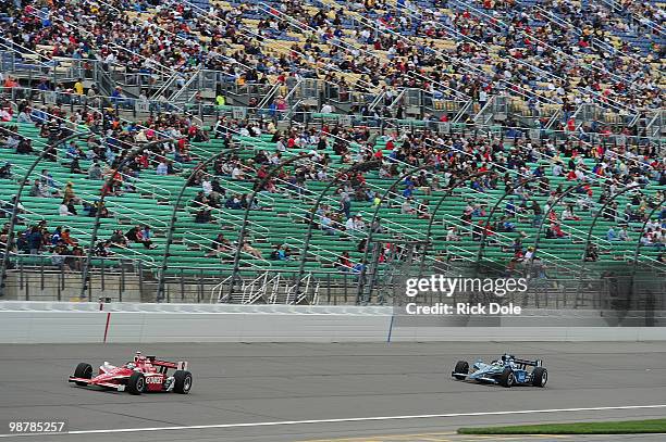 Scott Dixon of New Zealand drives the Target Chip Ganassi Racing Dallara Honda in front of teammate Dario Franchitti during the Indy Car Series Road...