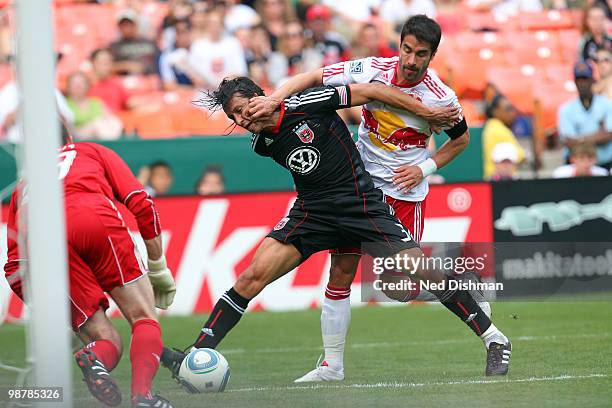 Juan Manuel Pena of D.C. United fights for possession against Juan Pablo Angel of the New York Red Bulls at RFK Stadium on May 1, 2010 in Washington,...