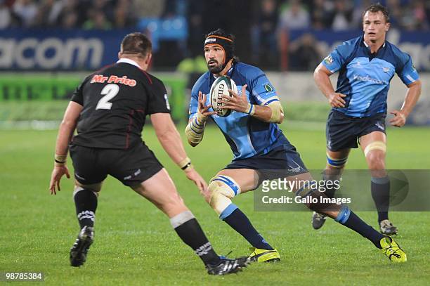 Victor Matfield of the Bulls looks for a way past John Smit of the Sharks during the Super 14 Round 12 match between the Vodacom Blue Bulls and the...