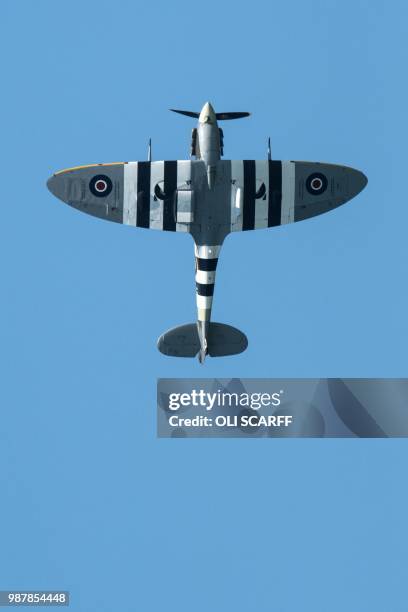 Spitfire performs an aerobatic display during the national Armed Forces Day celebrations at Llandudno, north Wales on June 30, 2018. - The annual...