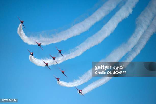 The Royal Air Force Aerobatic Team, the Red Arrows perform an aerobatic display during the national Armed Forces Day celebrations at Llandudno, north...