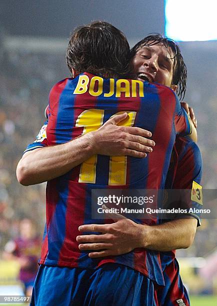 Lionel Messi of FC Barcelona celebrate with his teammate Bojan Krkic during the La Liga match between Villarreal CF and FC Barcelona at El Madrigal...