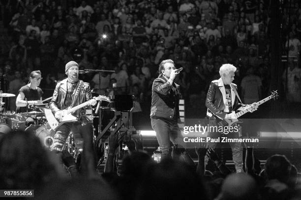 The Edge, Larry Mullen, Jr., Bono, and Adam Clayton of U2 perform onstage during the eXPERIENCE + iNNOCENCE TOUR at Prudential Center on June 29,...