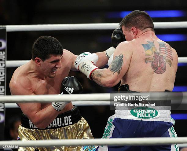 Marco Huck of Germany and Brian Minto of the U.S. Exchange punches during their WBO World Championship Cruiserweight title fight at the...