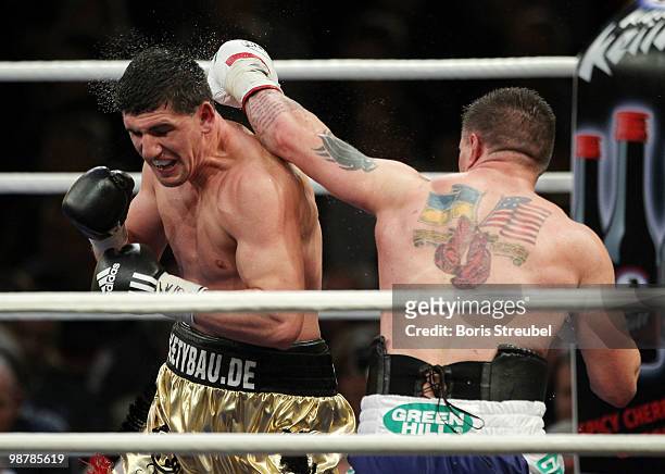 Marco Huck of Germany and Brian Minto of the U.S. Exchange punches during their WBO World Championship Cruiserweight title fight at the...