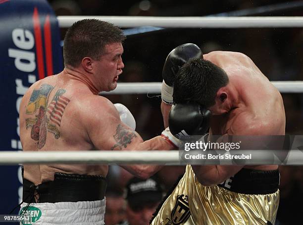 Marco Huck of Germany and Brian Minto of the U.S. Exchange punches during their WBO World Championship Cruiserweight title fight at the...